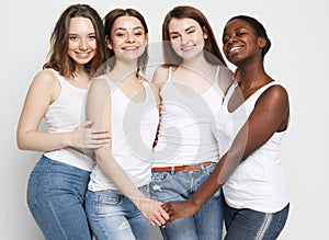 Group of four girls friends of different nationalities