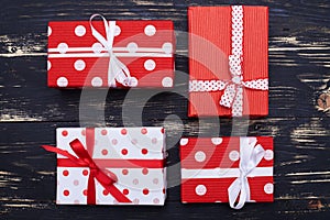 Group of four present boxes tied with ribbon