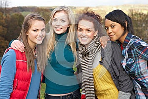 Group Of Four Teenage Female Friends In Autumn