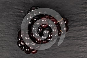 Fresh blackberry on grey stone