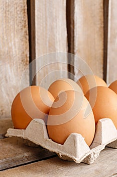 Group of fresh eggs in paper tray