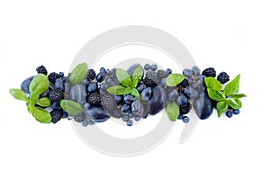 Group of fresh fruits and berries with basil`s on a white background