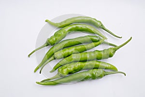 Group of fresh green chili peppers isolated on white background