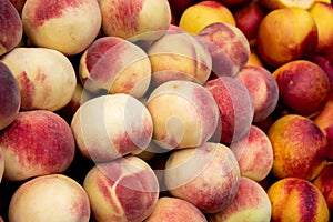 Fresh and juicy  peach fruits on a fruit market