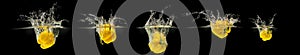 Group of fresh lemon fruits falling in water with splash on black background