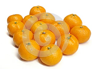 A group of fresh mandarin oranges arranged on a clean white background.