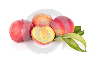 Group of fresh peaches with leaves