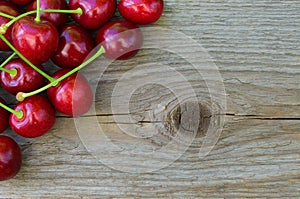 Group of Fresh Ripe Red Sweet Cherries on Wooden Background