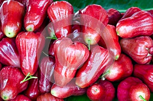 Group of fresh sweet red rose apple fruit pile