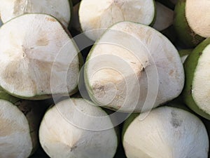 Group of fresh tropical sweet green coconut fruits ready to serve as beverage , popular refreshing sweet drinks