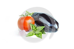 Fresh vegetables. Eggplant, tomato, garlic, green basil. Food ratatouille ingredients, summer harvest, isolated on white