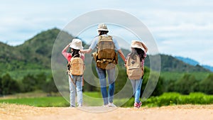 Group friend children travel nature summer trips.  Family Asia people tourism walking on road photo