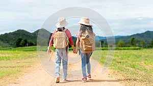 Group friend children travel nature summer trips.  Family Asia people tourism walking on road happy and fun explore