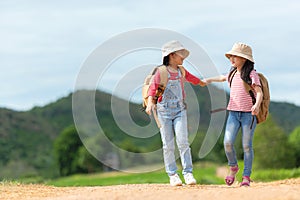 Group friend children travel nature summer trips.  Family Asia people tourism walking on road happy and fun explore adventure outd