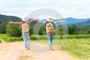 Group friend children travel nature summer trips.  Family Asia people tourism walking on road happy and fun explore adventure outd