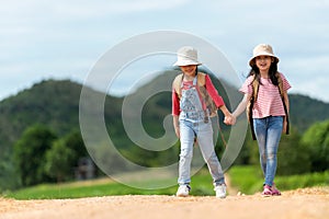 Group friend children travel nature summer trips. Family Asia people tourism walking on road happy