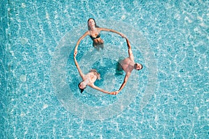 Group of friend play together in a swimming pool