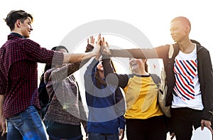 Group of friends all high five together support and teamwork concept