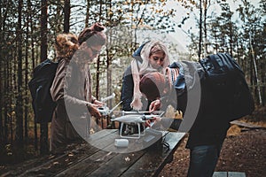 Group or friends are assembling drone