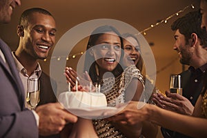 Group Of Friends Celebrating Birthday With Party At Home