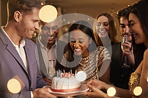 Group Of Friends Celebrating Birthday With Party At Home