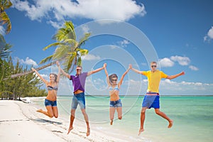 Group of friends or couples jumping on the beach