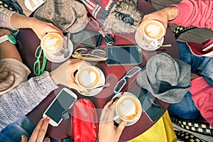 Group of friends drinking cappuccino at coffee bar restaurants