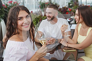 Group of friends drinking on a rooftop party