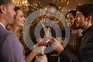 Group Of Friends With Drinks Enjoying Cocktail Party