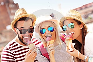 Group of friends eating ice-cream in Gdansk