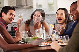 Group Of Friends Enjoying Dinner Party At Home