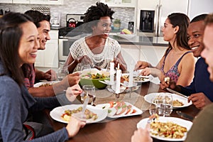 Group Of Friends Enjoying Dinner Party At Home