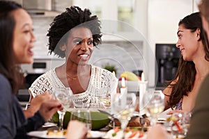 Group Of Friends Enjoying Dinner Party At Home