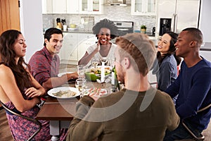 Group Of Friends Enjoying Dinner Party At Home