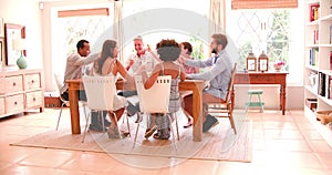 Group Of Friends Enjoying Dinner Party At Home Together