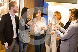 Group of friends enjoying evening drinks in bar