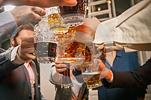 Group of friends enjoying evening drinks with beer