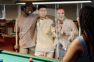 Group of Friends Enjoying Game of Pool