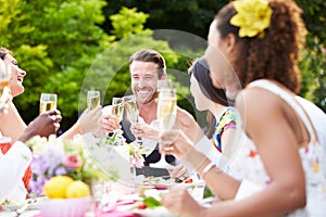 Group Of Friends Enjoying Outdoor Dinner Party