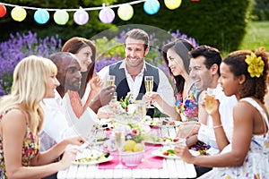 Group Of Friends Enjoying Outdoor Dinner Party