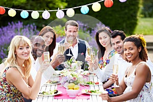Group Of Friends Enjoying Outdoor Dinner Party