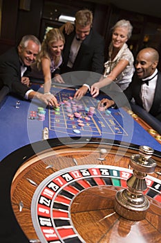 Group of friends of gambling in casino