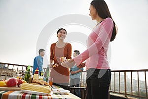 Group of Friends Having a Barbeque on a Rooftop