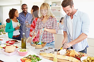 Group Of Friends Having Dinner Party At Home