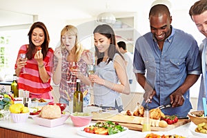 Group Of Friends Having Dinner Party At Home