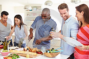 Group Of Friends Having Dinner Party At Home