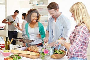 Group Of Friends Having Dinner Party At Home