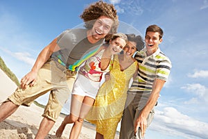 Group Of Friends Having Fun On Beach