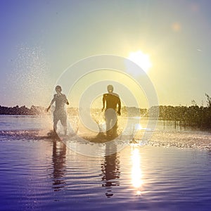 Group of friends having fun on the beach