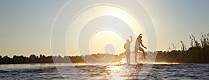 Group of friends having fun on the beach